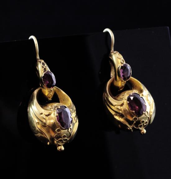 A pair of Victorian style gold and garnet set double link drop earrings, overall 1.25in.